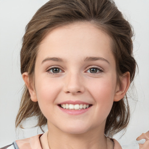 Joyful white child female with medium  brown hair and grey eyes