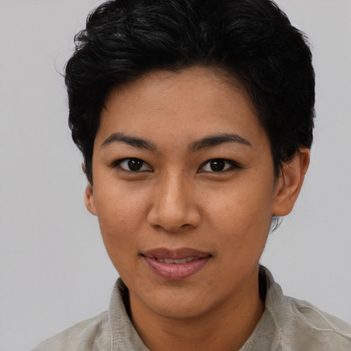 Joyful asian adult female with short  black hair and brown eyes