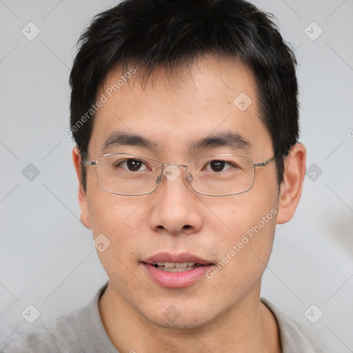 Joyful asian young-adult male with short  brown hair and brown eyes