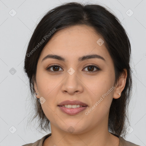 Joyful latino young-adult female with medium  brown hair and brown eyes