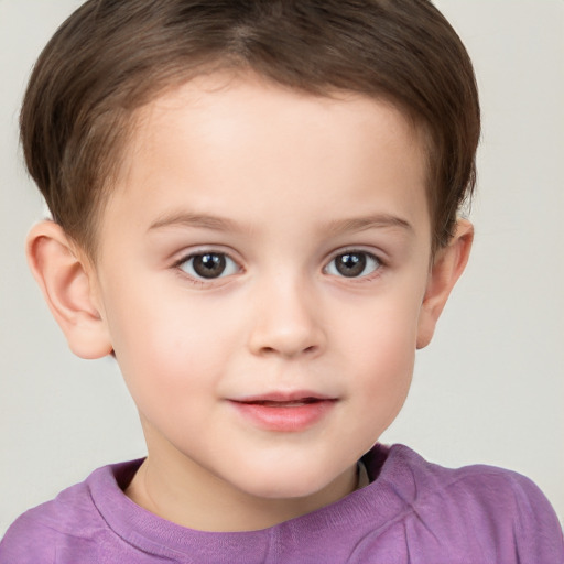 Joyful white child male with short  brown hair and brown eyes