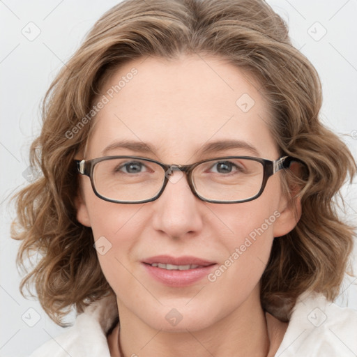 Joyful white adult female with medium  brown hair and blue eyes