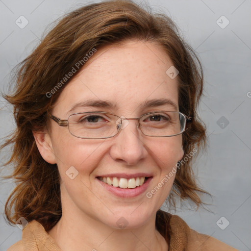 Joyful white adult female with medium  brown hair and blue eyes