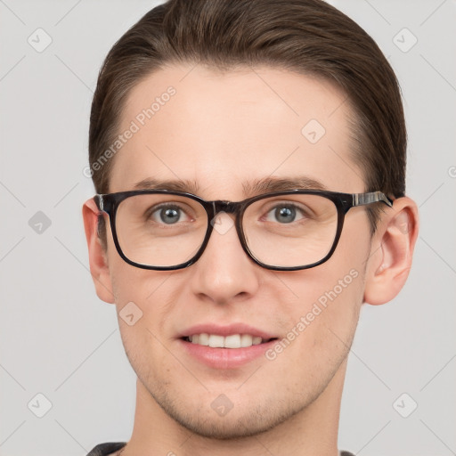 Joyful white young-adult male with short  brown hair and grey eyes