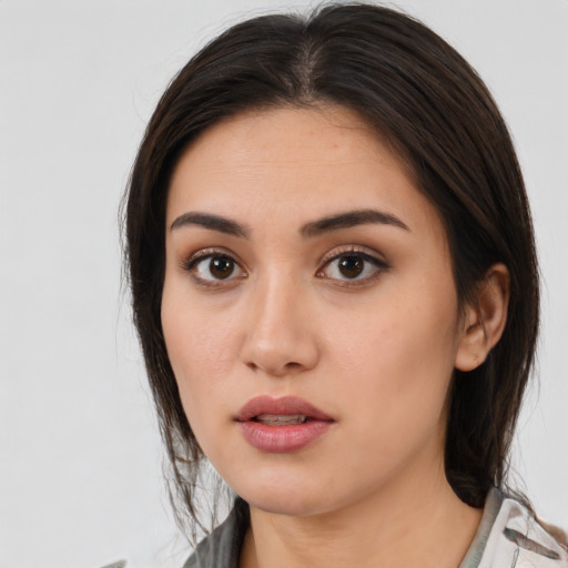 Neutral white young-adult female with medium  brown hair and brown eyes