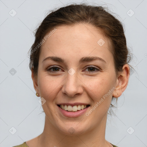 Joyful white young-adult female with medium  brown hair and grey eyes