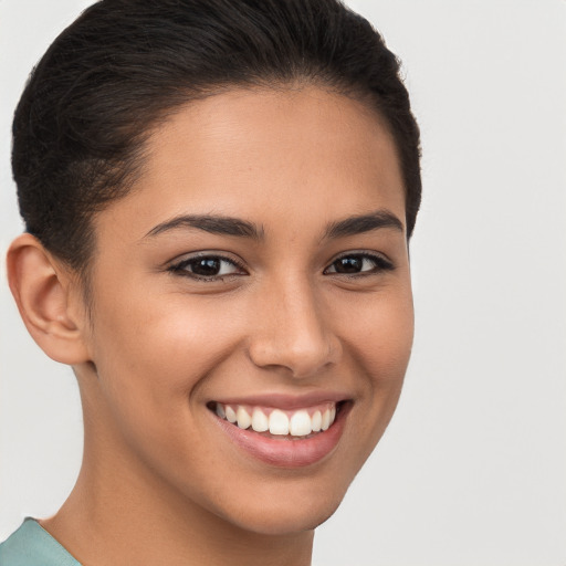 Joyful white young-adult female with short  brown hair and brown eyes