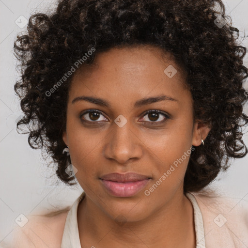 Joyful black young-adult female with medium  brown hair and brown eyes