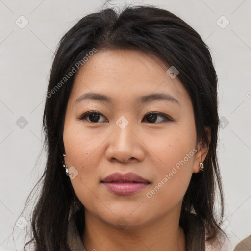 Joyful asian young-adult female with long  brown hair and brown eyes