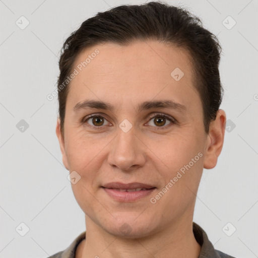 Joyful white adult female with short  brown hair and brown eyes