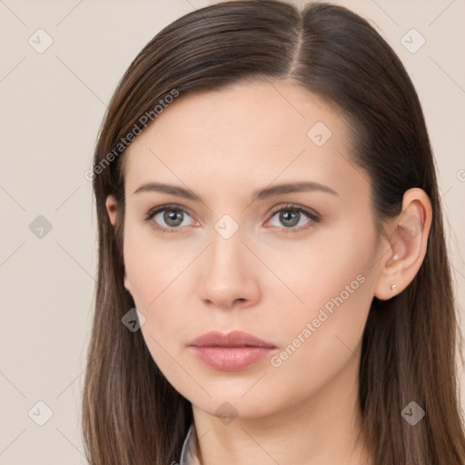 Neutral white young-adult female with long  brown hair and brown eyes