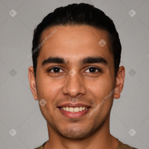 Joyful white young-adult male with short  black hair and brown eyes