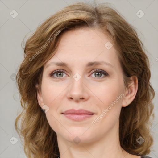 Joyful white young-adult female with medium  brown hair and green eyes