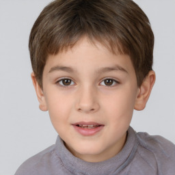 Joyful white child male with short  brown hair and brown eyes