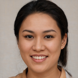 Joyful white young-adult female with medium  brown hair and brown eyes