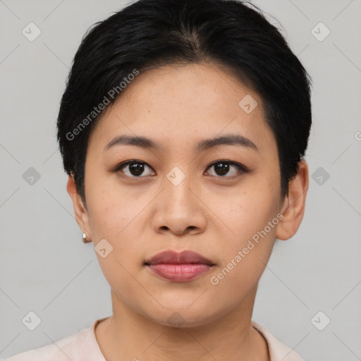 Joyful asian young-adult female with short  black hair and brown eyes