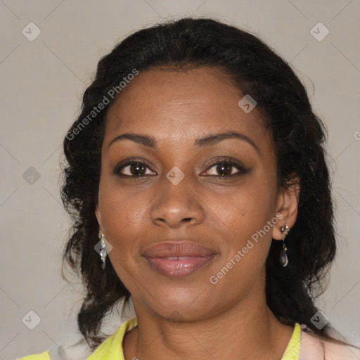 Joyful black adult female with medium  brown hair and brown eyes