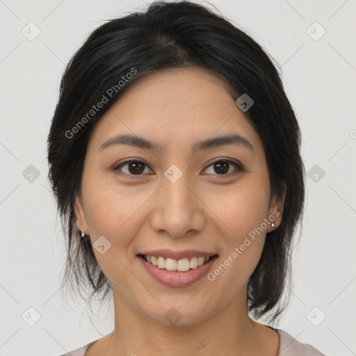 Joyful asian young-adult female with medium  brown hair and brown eyes