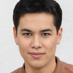 Joyful asian young-adult male with short  brown hair and brown eyes