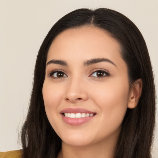 Joyful white young-adult female with long  black hair and brown eyes