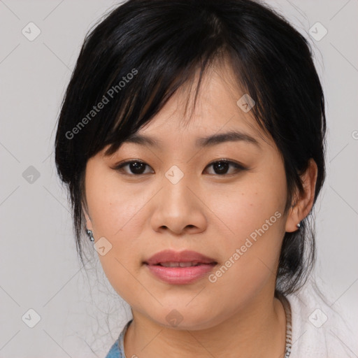 Joyful asian young-adult female with medium  black hair and brown eyes