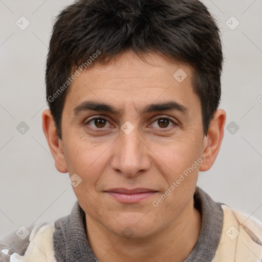 Joyful white adult male with short  brown hair and brown eyes