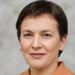 Joyful white adult female with short  brown hair and brown eyes