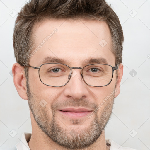 Joyful white adult male with short  brown hair and grey eyes