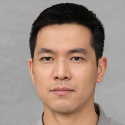 Neutral asian young-adult male with short  black hair and brown eyes