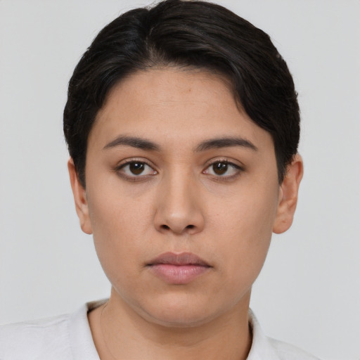 Neutral white young-adult female with short  black hair and brown eyes