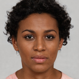 Neutral black young-adult female with short  brown hair and brown eyes