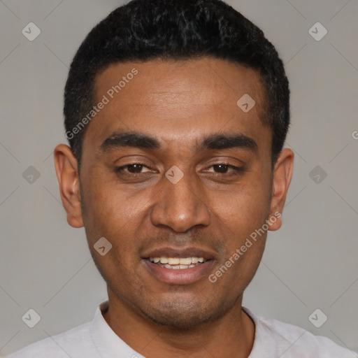 Joyful black young-adult male with short  black hair and brown eyes