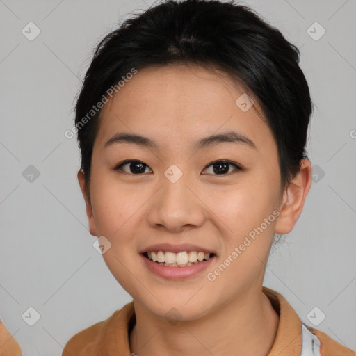 Joyful asian young-adult female with short  brown hair and brown eyes