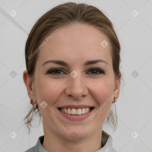 Joyful white young-adult female with medium  brown hair and grey eyes