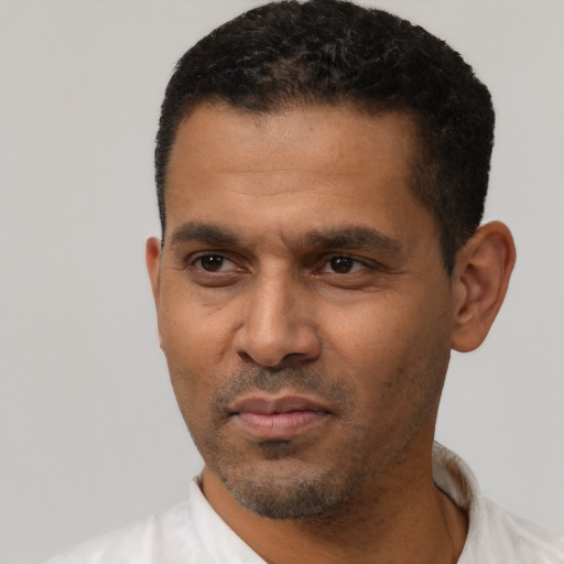 Neutral latino adult male with short  black hair and brown eyes