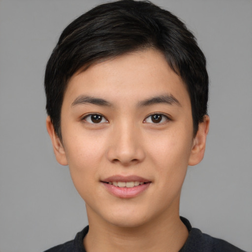 Joyful asian young-adult male with short  black hair and brown eyes