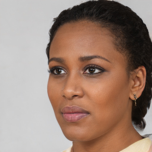 Neutral black young-adult female with short  black hair and brown eyes