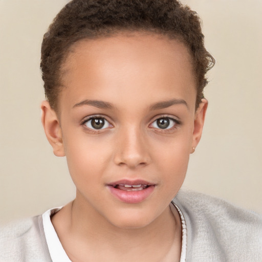 Joyful white child female with short  brown hair and brown eyes