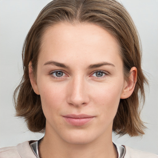 Neutral white young-adult female with medium  brown hair and grey eyes