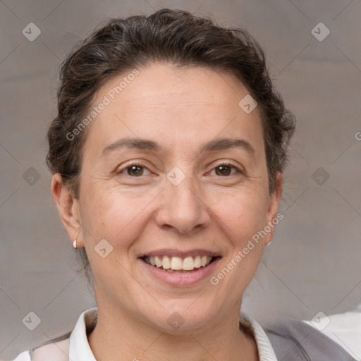 Joyful white adult female with short  brown hair and brown eyes