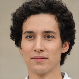 Joyful white adult male with medium  brown hair and brown eyes