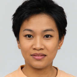 Joyful asian young-adult female with short  black hair and brown eyes