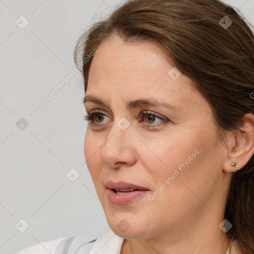 Joyful white adult female with medium  brown hair and brown eyes