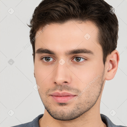 Neutral white young-adult male with short  brown hair and brown eyes