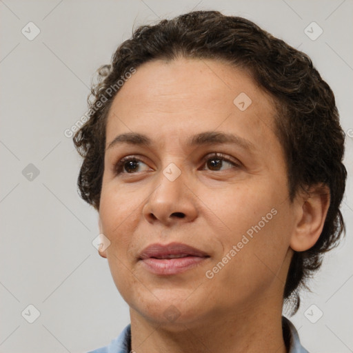 Joyful white adult female with short  brown hair and brown eyes