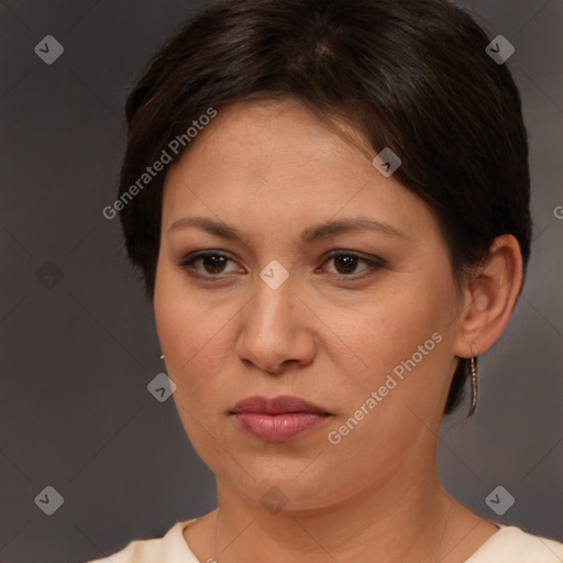 Joyful white adult female with short  brown hair and brown eyes