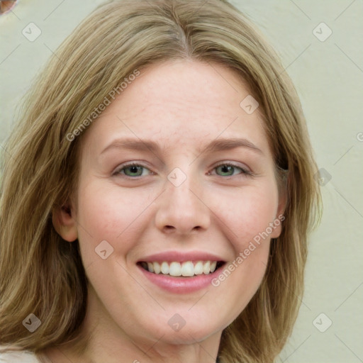 Joyful white young-adult female with medium  brown hair and green eyes