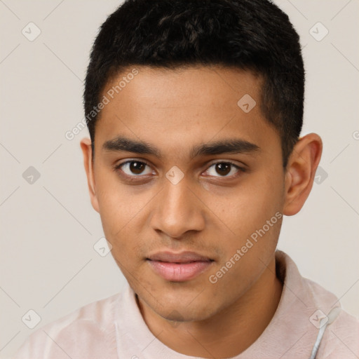 Joyful latino young-adult male with short  brown hair and brown eyes