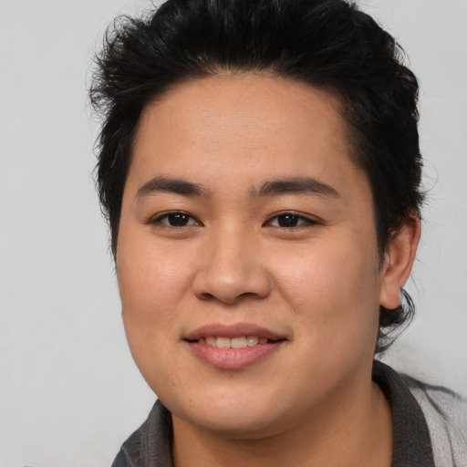 Joyful asian young-adult female with short  brown hair and brown eyes
