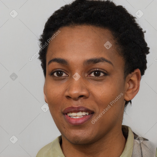 Joyful black young-adult female with short  brown hair and brown eyes